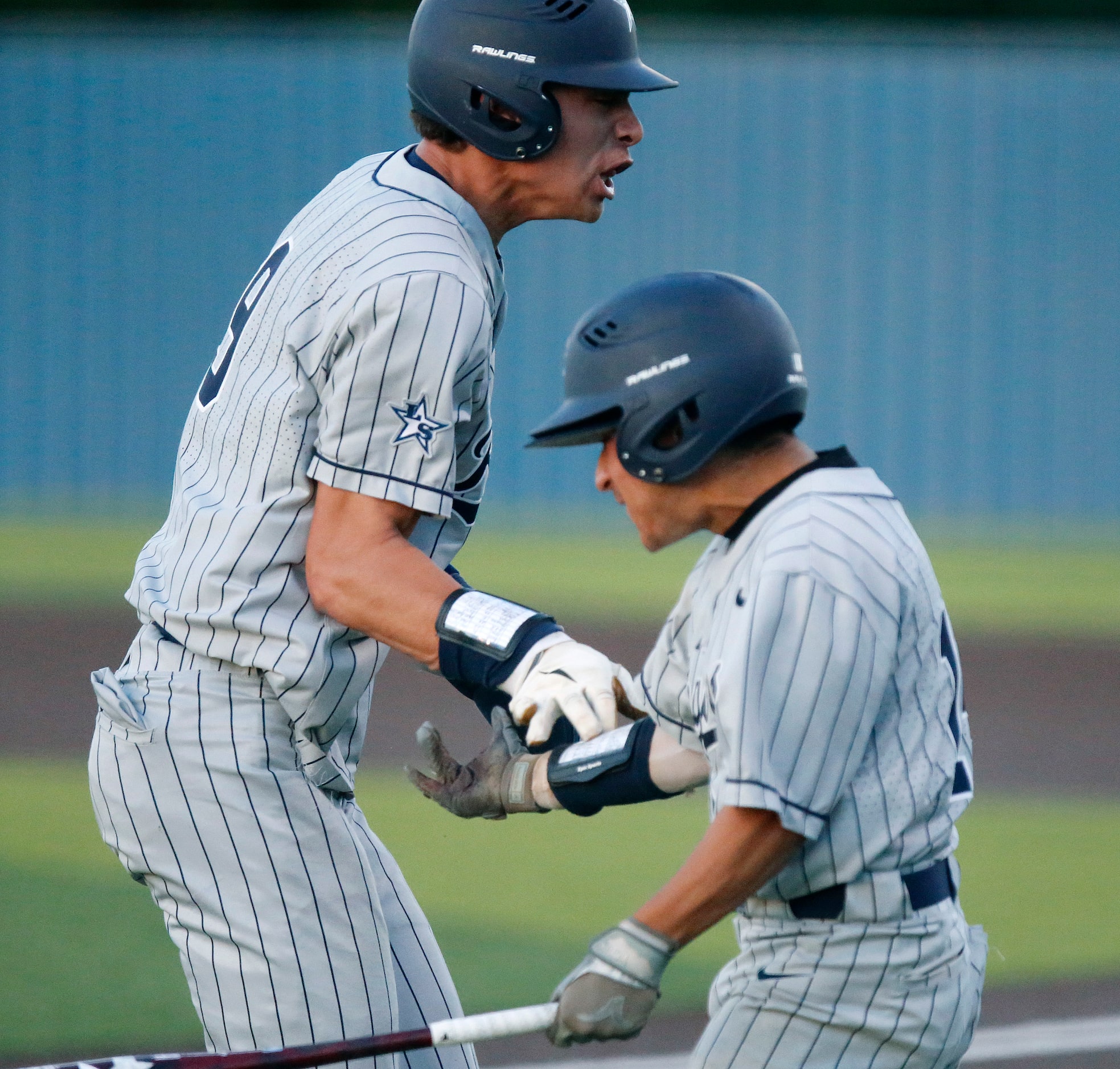 Lone Star High School infielder Caleb Reynolds (9) celebrates with Lone Star High School...