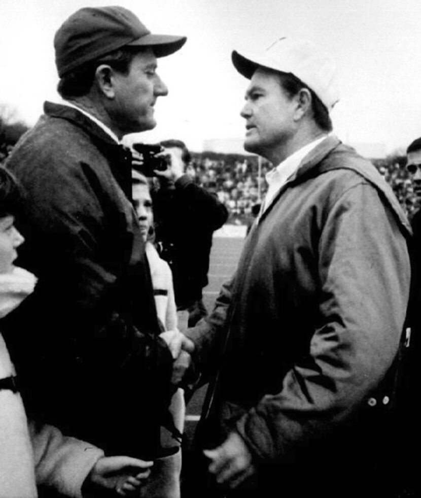 Arkansas football coach Frank Broyles, left, and Texas coach Darrell Royal greet on the...