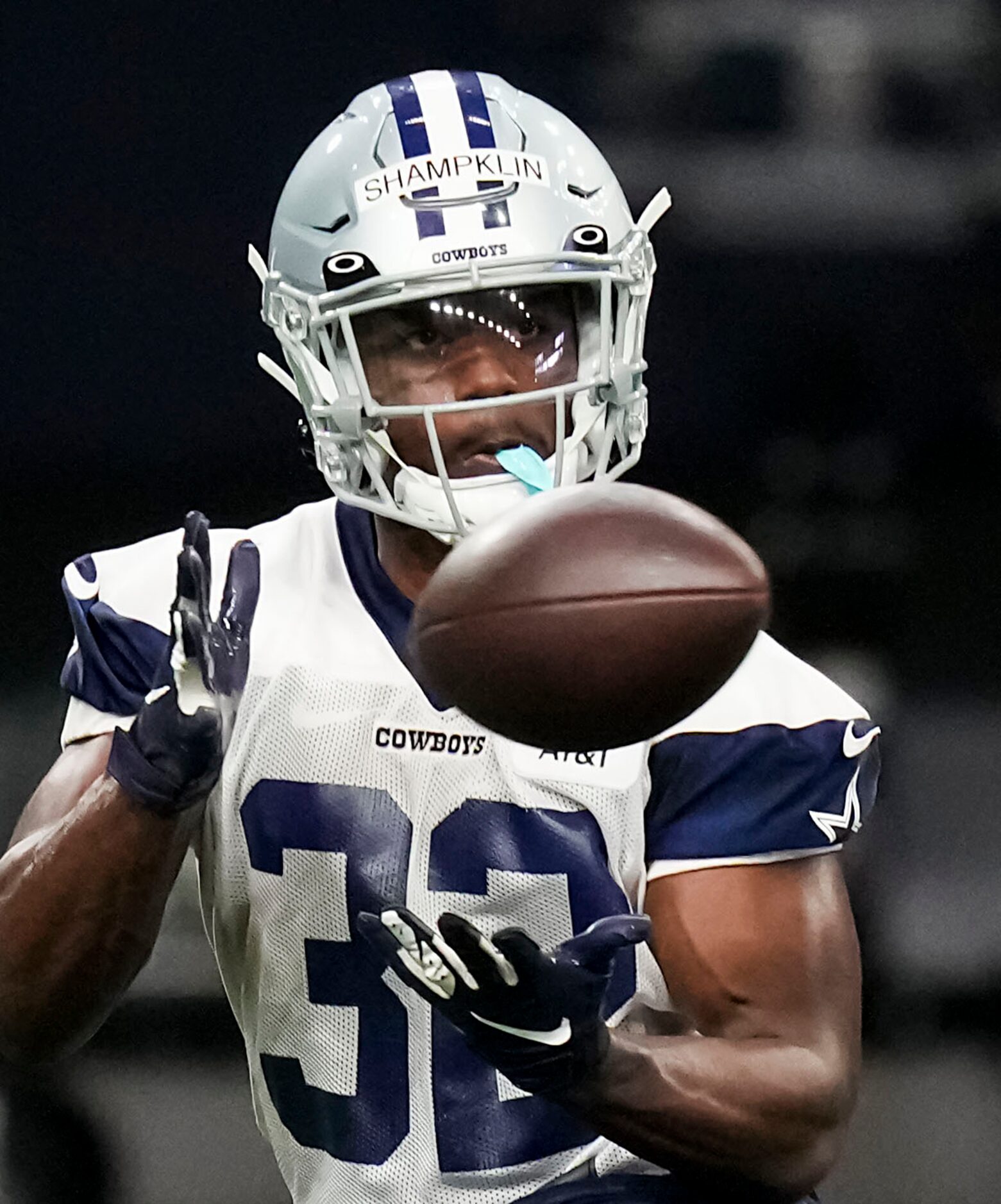 Dallas Cowboys running back Aaron Shampklin catches a pass during the OTA team's practice at...