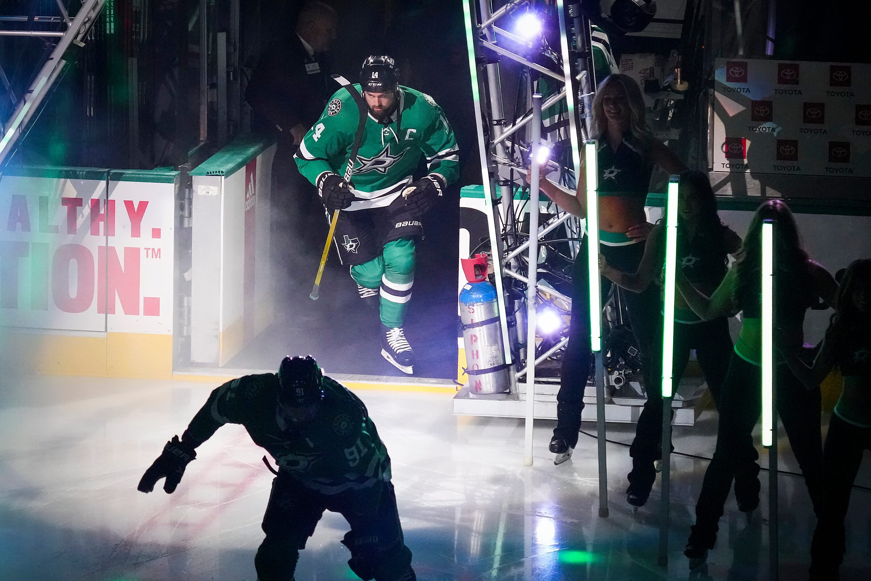 Dallas Stars left wing Jamie Benn (14) and center Tyler Seguin (91) take the ice before the...