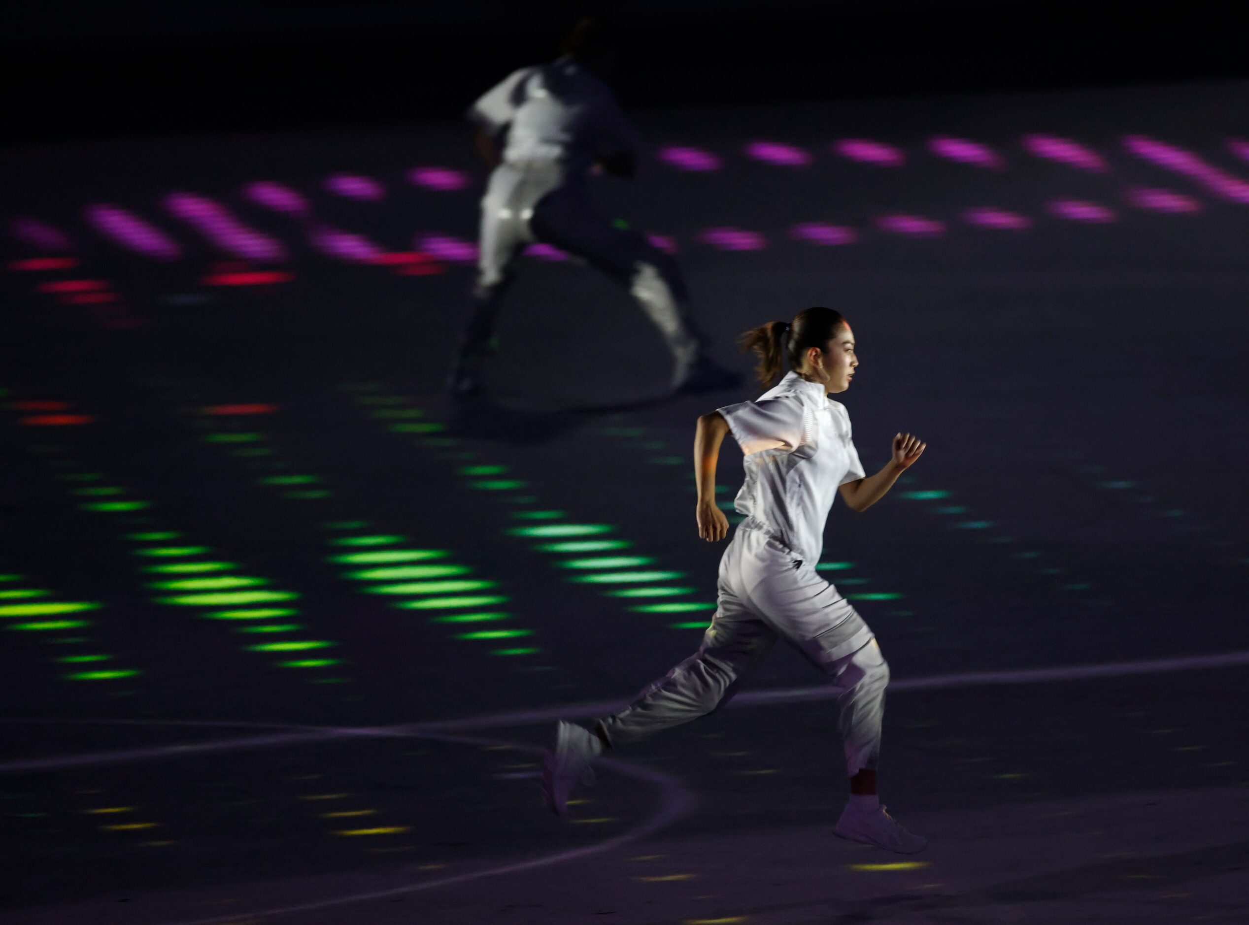 Entertainers performs during the opening ceremony for the postponed 2020 Tokyo Olympics at...