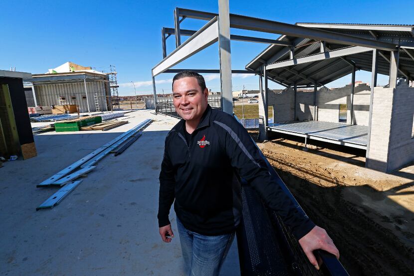 Ian Vaughn poses for a photograph at Lava Cantina, which is under construction, in The...