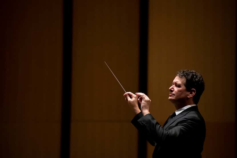 Conductor Greg Hobbs directs the Highland Park Chorale and Orchestra at Moody Performance...