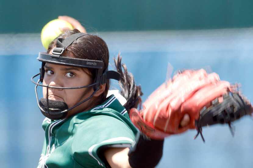 Mansfield Lake Ridge pitcher Kaly Gonzales (22) delivers a pitch to a Hillcrest batter...