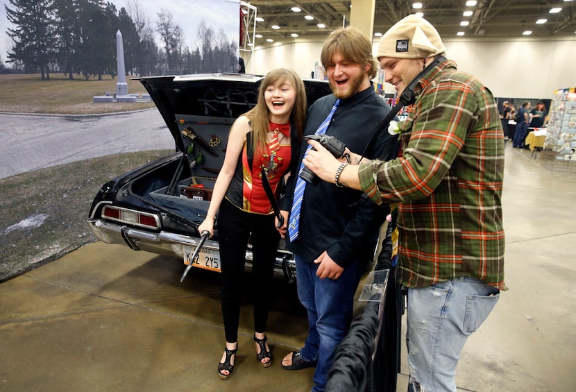 Mim Mott of McKinney. dressed as Hermione Granger, and her boyfriend J.T. Martin (center),...