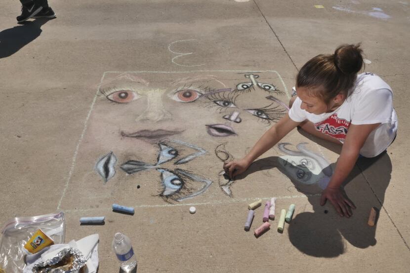  Andreana Tabacco, 13, of Frisco, took part in the Chalk Walk at the 2014 Arts in the Square...