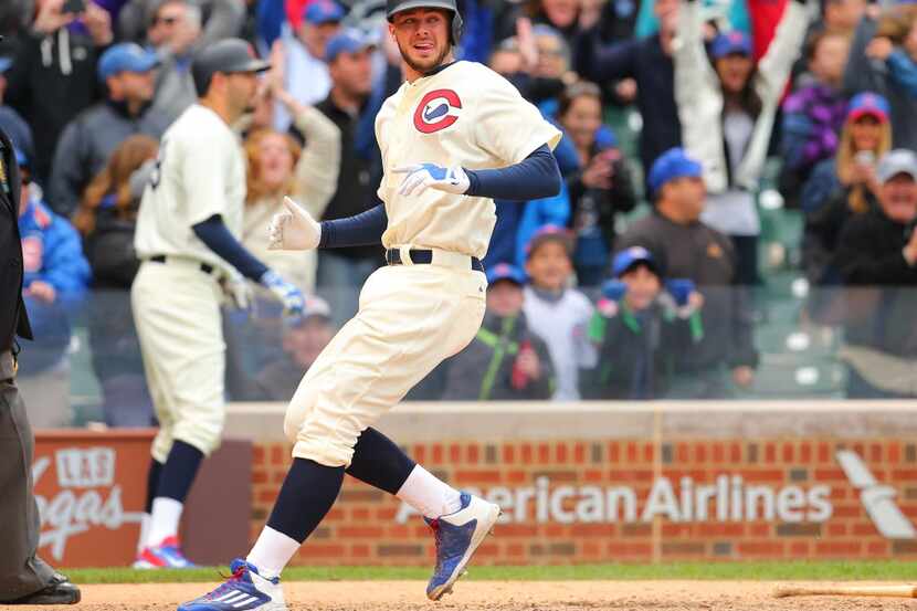 May 31, 2015; Chicago, IL, USA; Chicago Cubs third baseman Kris Bryant (17) scores the...