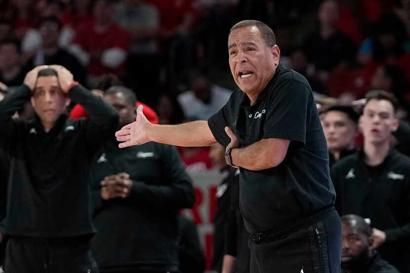 Houston coach Kelvin reacts to a foul call during the second half of an NCAA college...