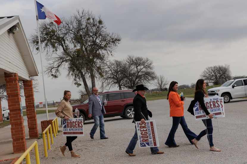 Supporters of state Rep. Glenn Rogers, R-Graford, leave a recent campaign event at a senior...