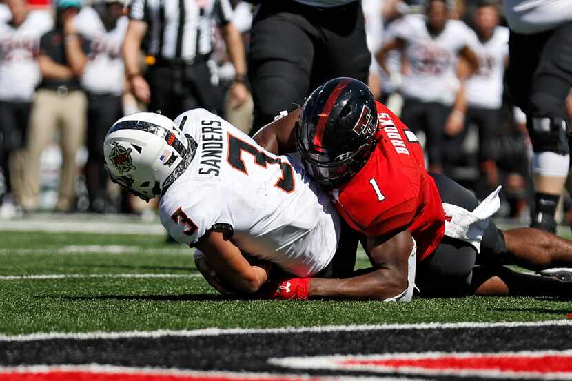 FILE - In this Oct. 5, 2019, file photo, Texas Tech's Jordyn Brooks (1) tackles Oklahoma...