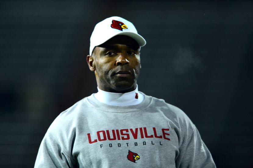 Louisville head coach Charlie Strong waits before the Cardinals game against Cincinnati...