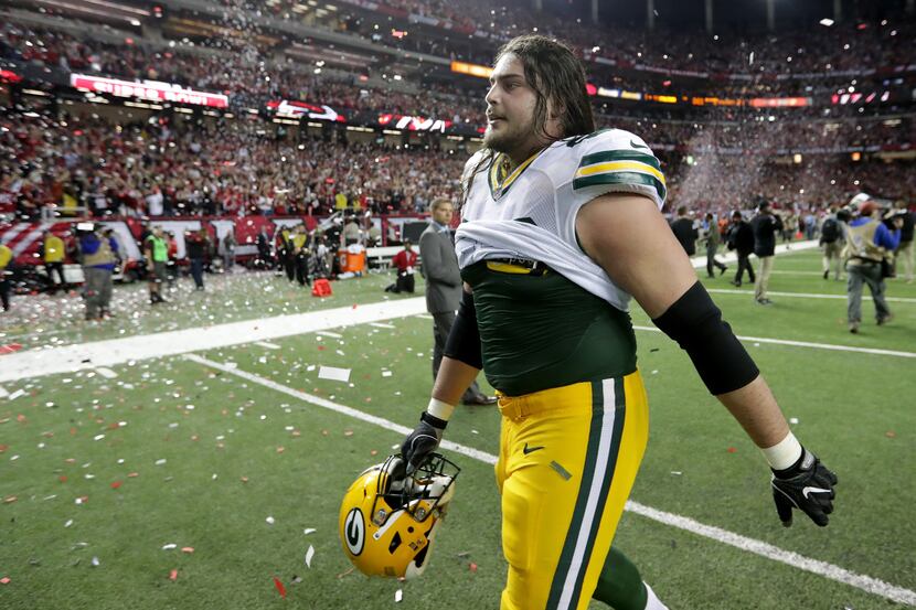 FILE - David Bakhtiari #69 of the Green Bay Packers walks off the field after being defeated...