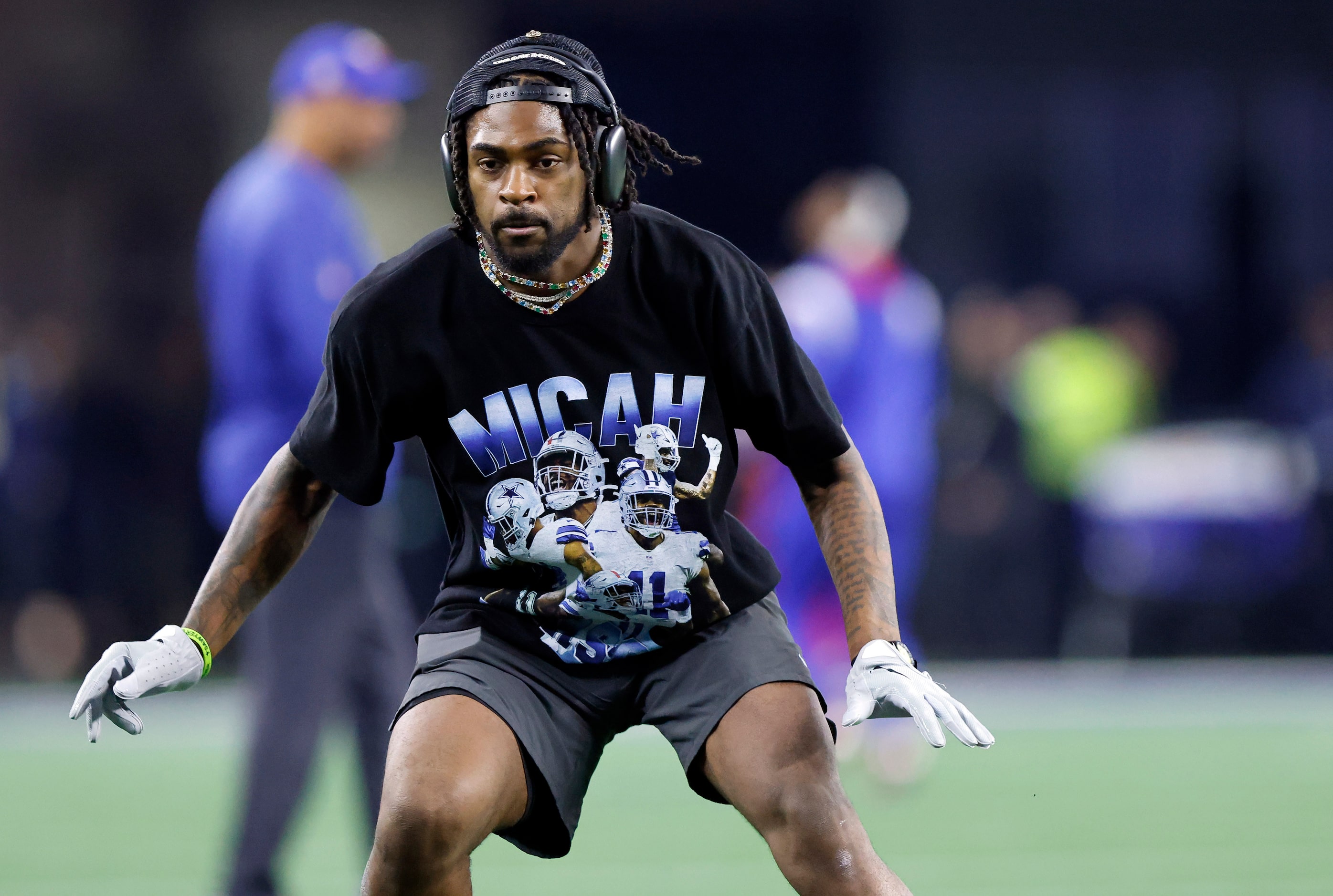 Dallas Cowboys cornerback Trevon Diggs works out in a Micah Parson t-shirt during pregame...