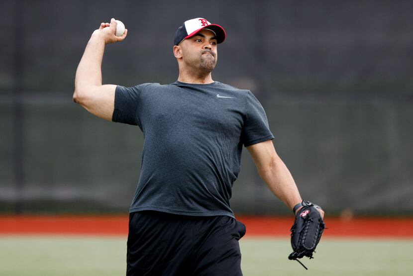 Rep. Colin Allred, D-Texas, a member of the Democratic Congressional Baseball team, throws...