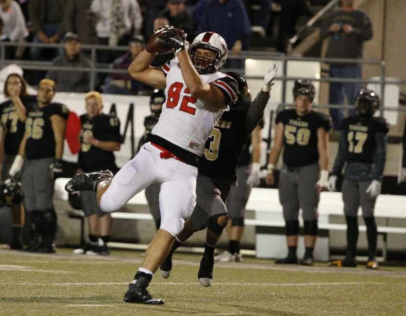 Flower Mound Marcus's Kaden Smith makes a reception against Mansfield's in the first half at...