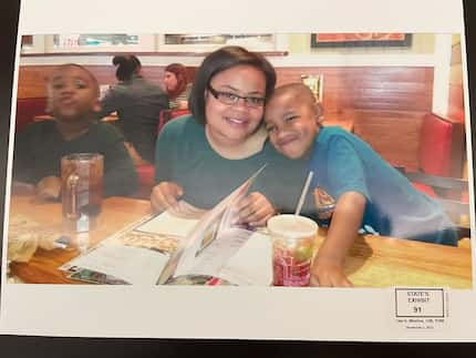 Atatiana Jefferson, pictured with her nephew Zion Carr, was killed Oct. 12, 2019, in her...