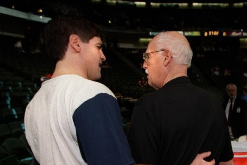 Dallas Maverick owner Mark Cuban, (L), walks and talks to his Dad, Norton Cuban, (R), before...