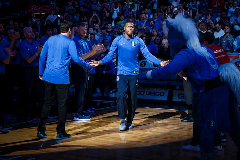 Dallas Mavericks guard Dennis Smith Jr. is introduced before an NBA basketball game against...