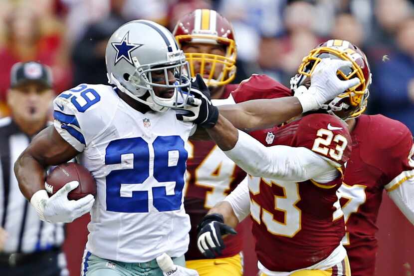 Dallas Cowboys running back DeMarco Murray (29) pushes away Washington Redskins cornerback...