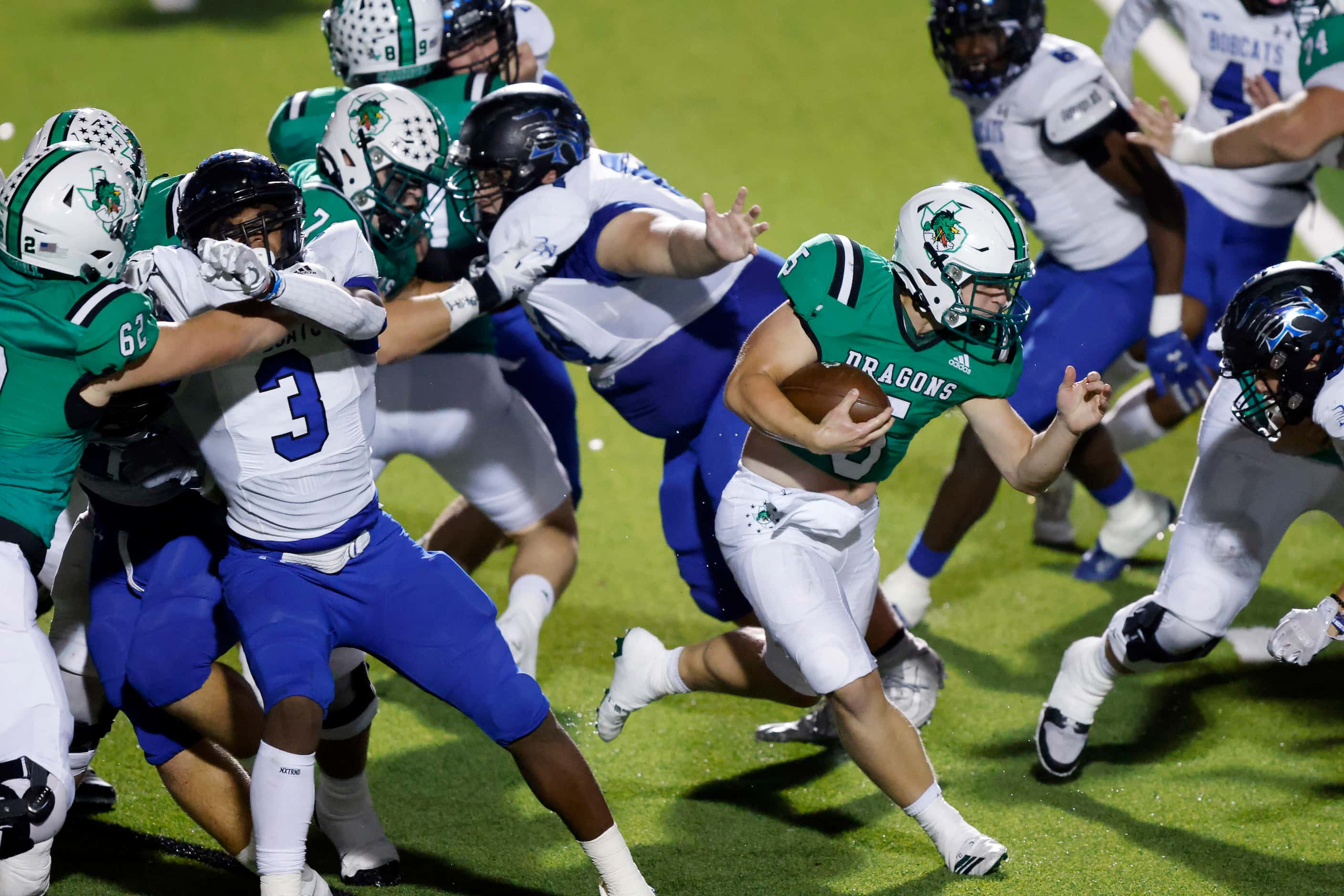 Southlake Carroll running back James Lehman (5) finds a hole in the Byron Nelson defense for...