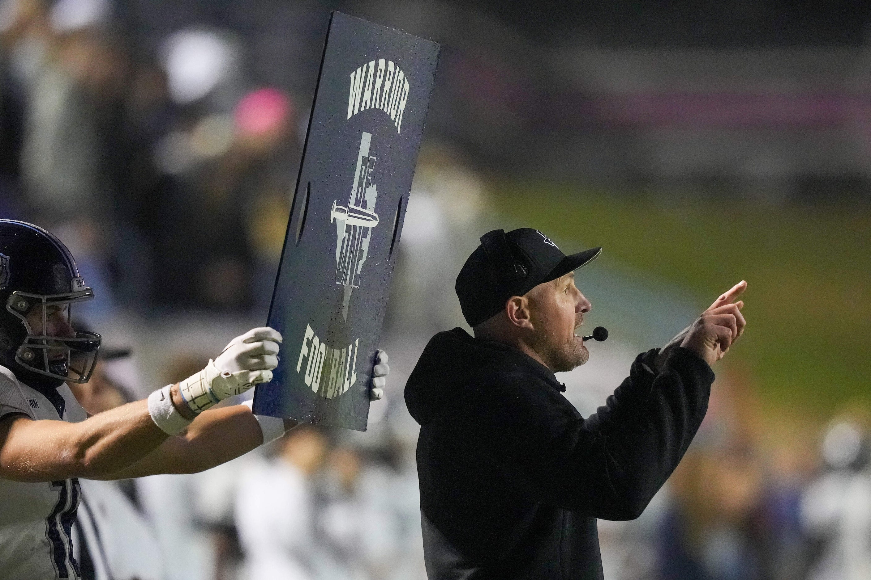 Argyle Liberty Christian head coach Jason Witten signals in a play during the first half of...