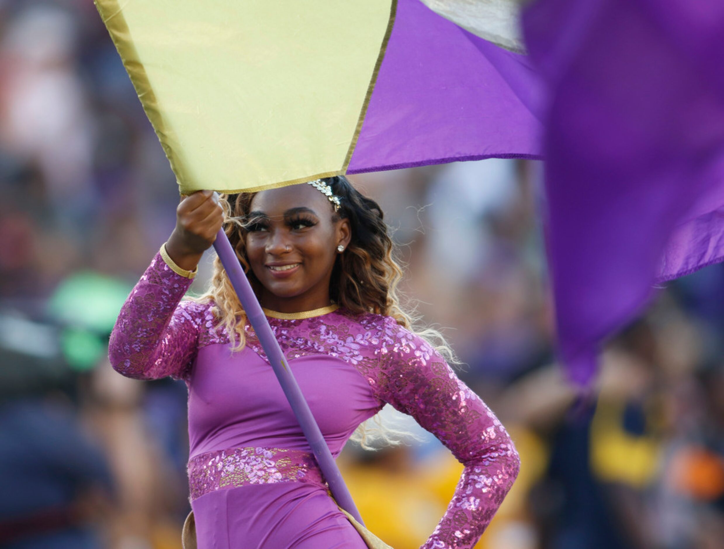 Prairie View student De'Jah Nichols performs with flag corps and band members during their...