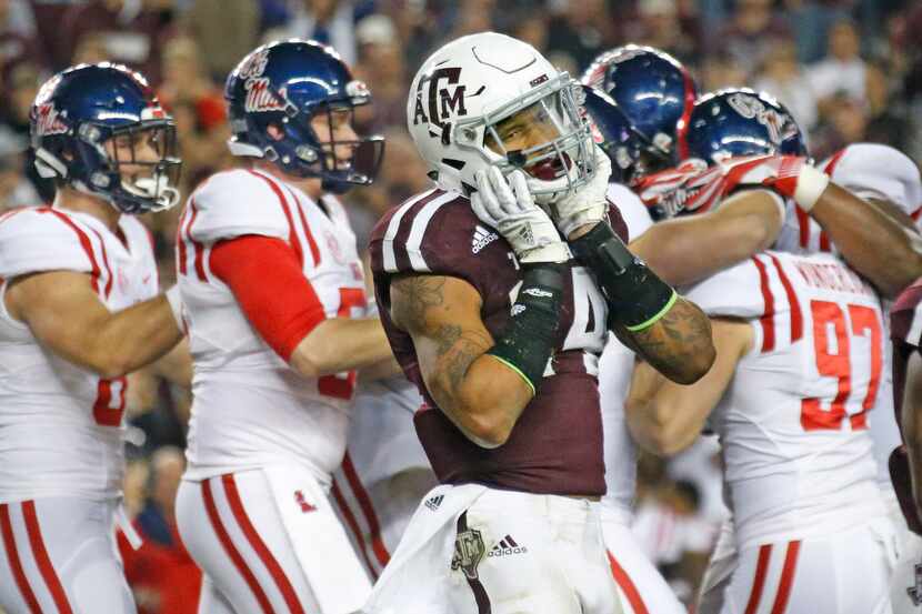 Texas A&M Aggies defensive back Justin Evans (14) can't believe the Aggie victory has...