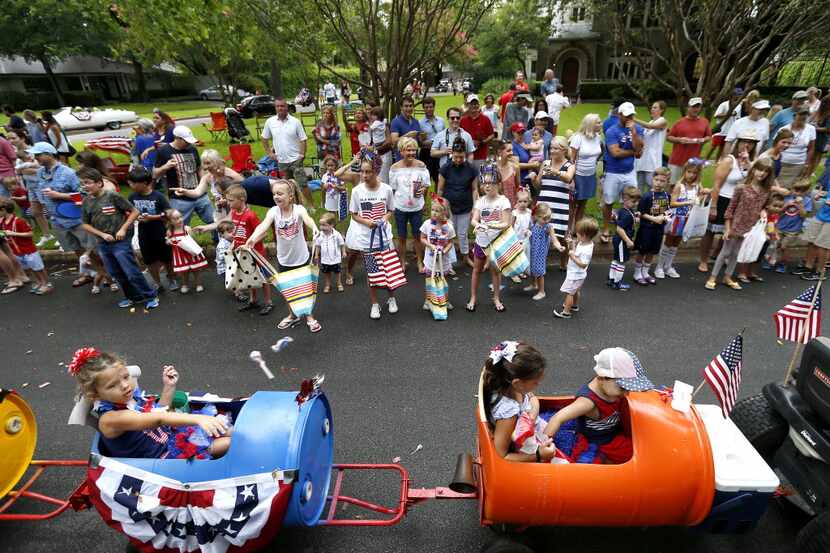 Spectators watch the Lakewood Fourth of July Parade in Dallas, Monday, July 4, 2016.