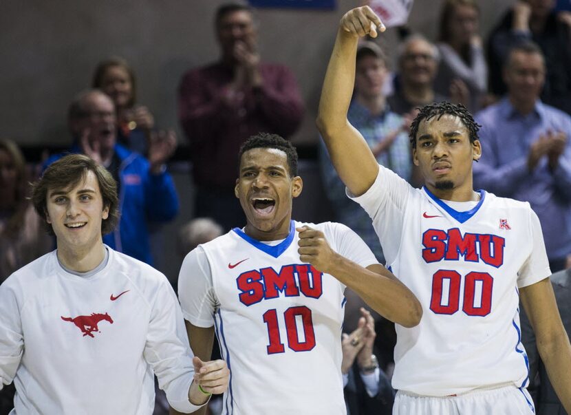 Southern Methodist Mustangs guard Jonathan Wilfong (22), guard Jarrey Foster (10) and...