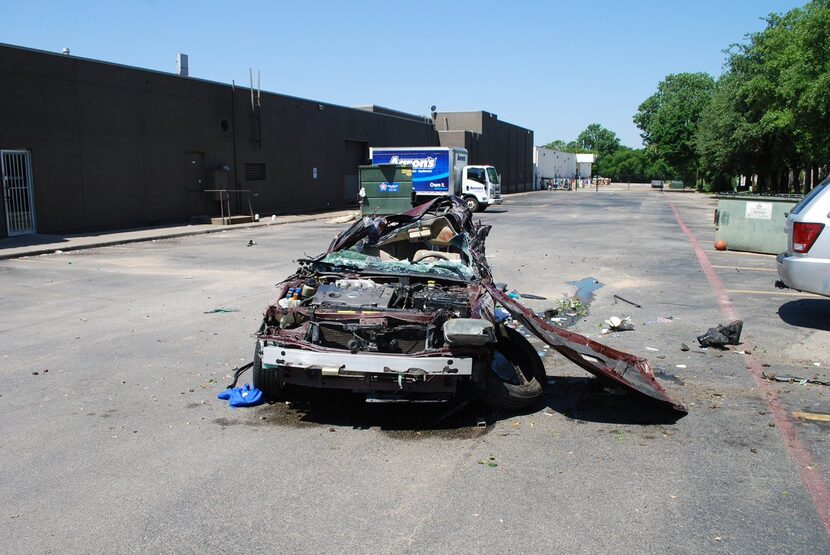 The stolen car was totaled after the driver lost control and the vehicle rolled a number of...