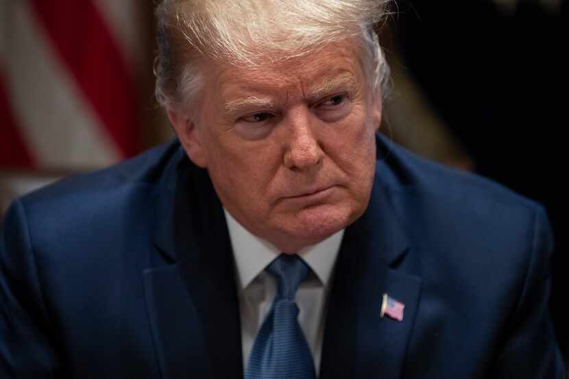 President Donald Trump listens during a roundtable with governors on government regulations...