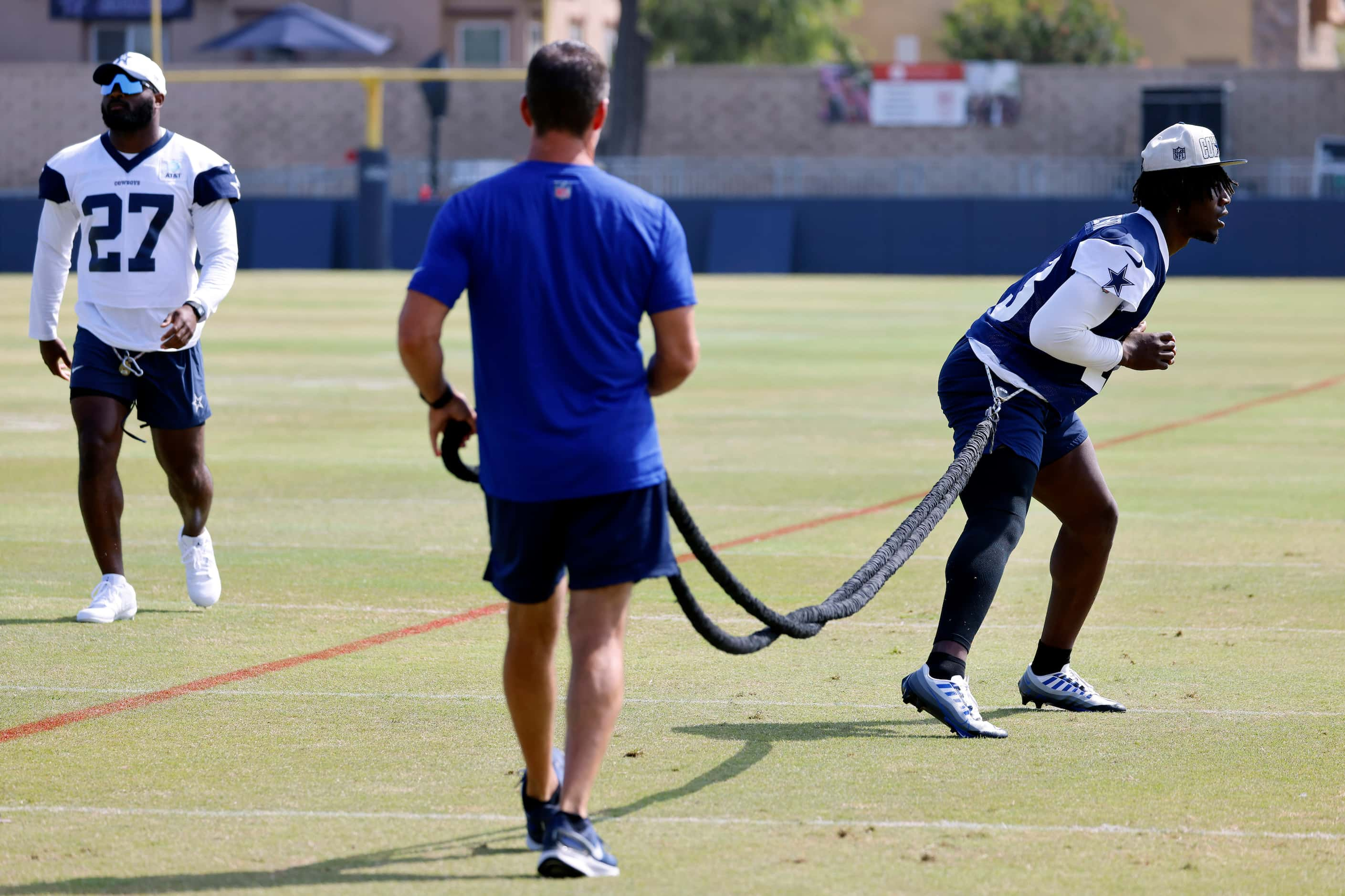 Dallas Cowboys linebacker DeMarvion Overshown (13) works out on the exercise cord. He and...