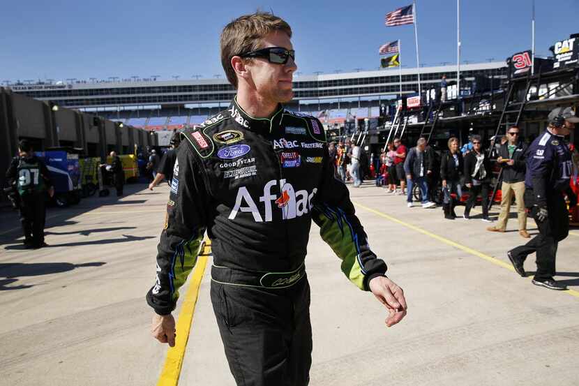 Sprint Cup Series driver Carl Edwards heads to his trailer following Texas 500 practice at...