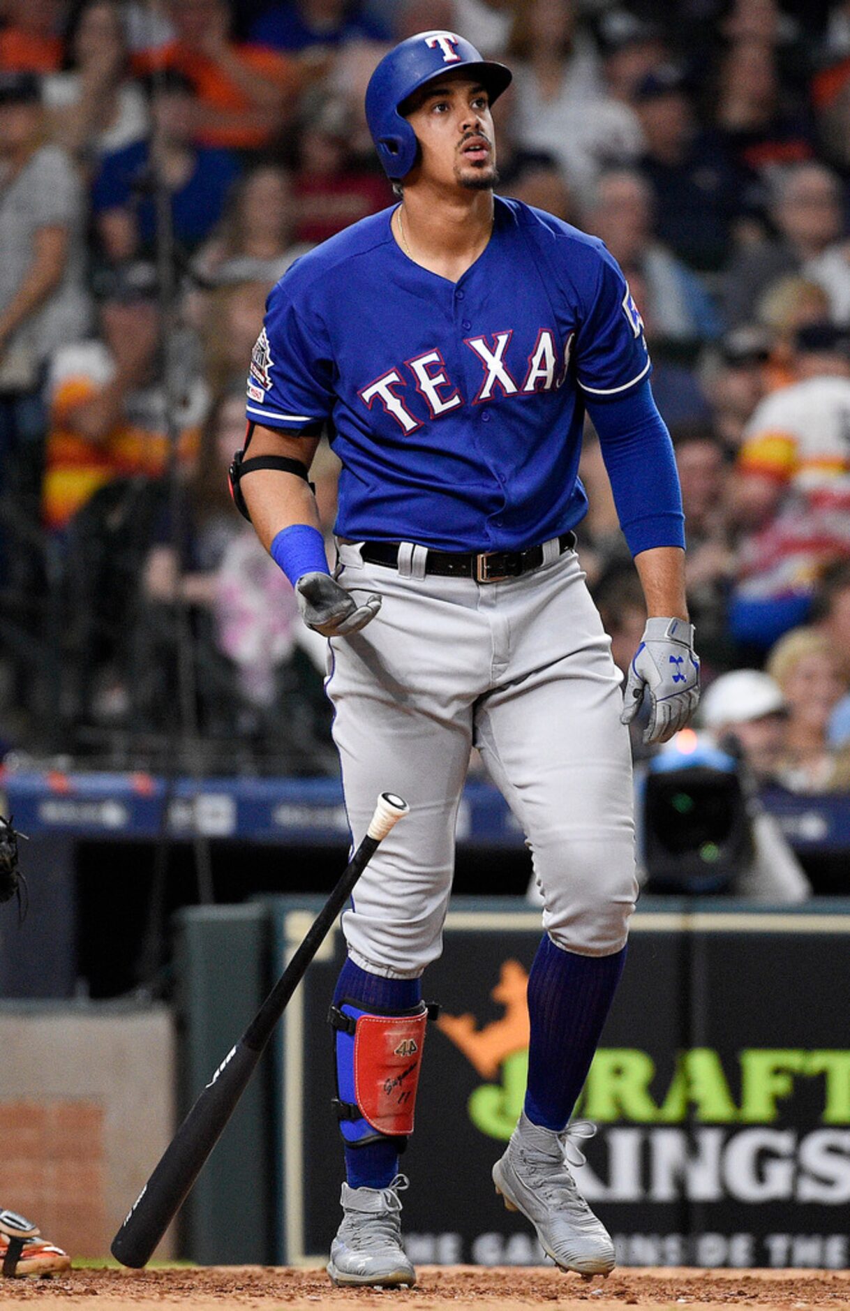 Texas Rangers' Ronald Guzman watches his three-run home run off Houston Astros relief...