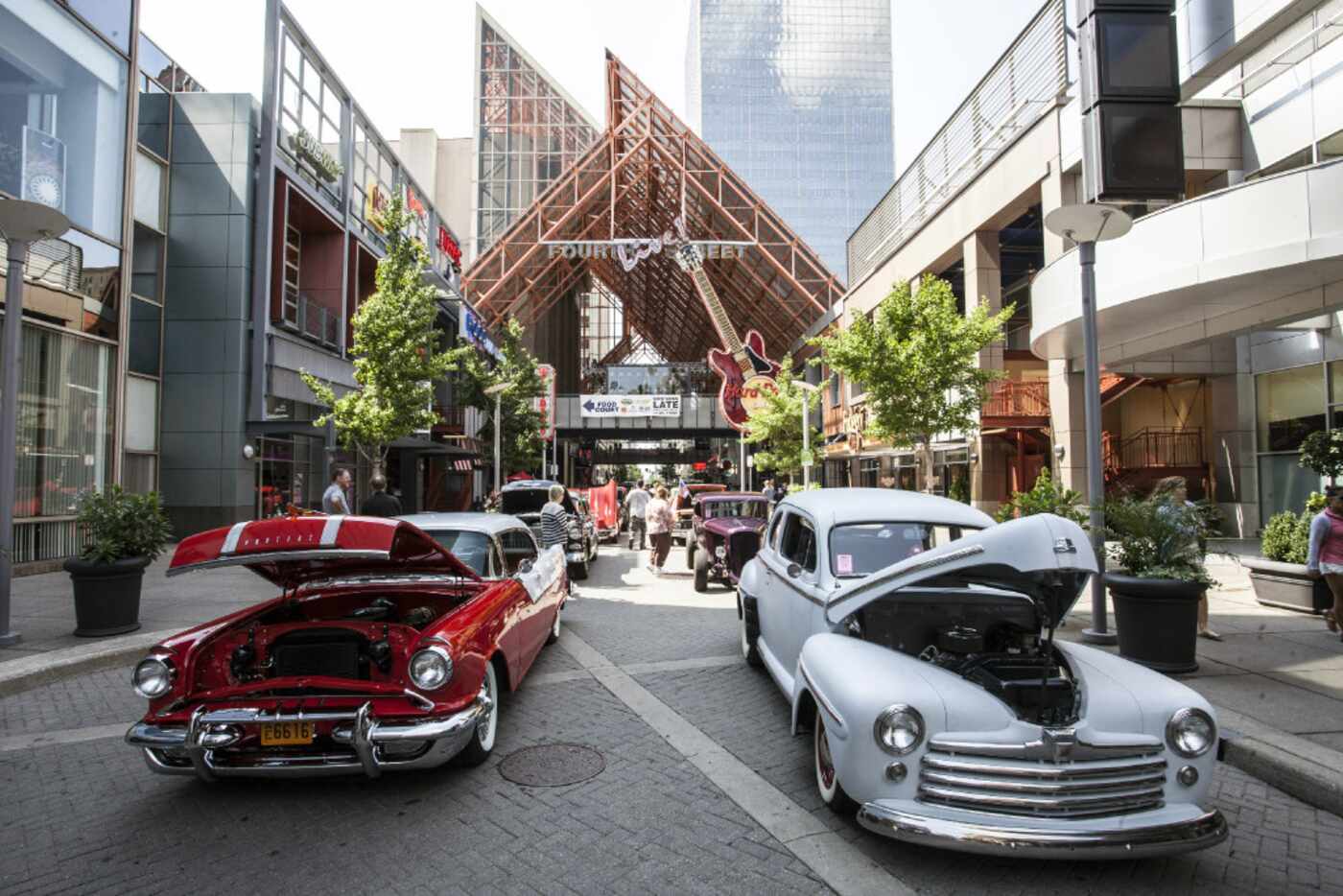 Vintage street hot rods draw interest from the lunchtime crowd at Fourth Street Live! in...