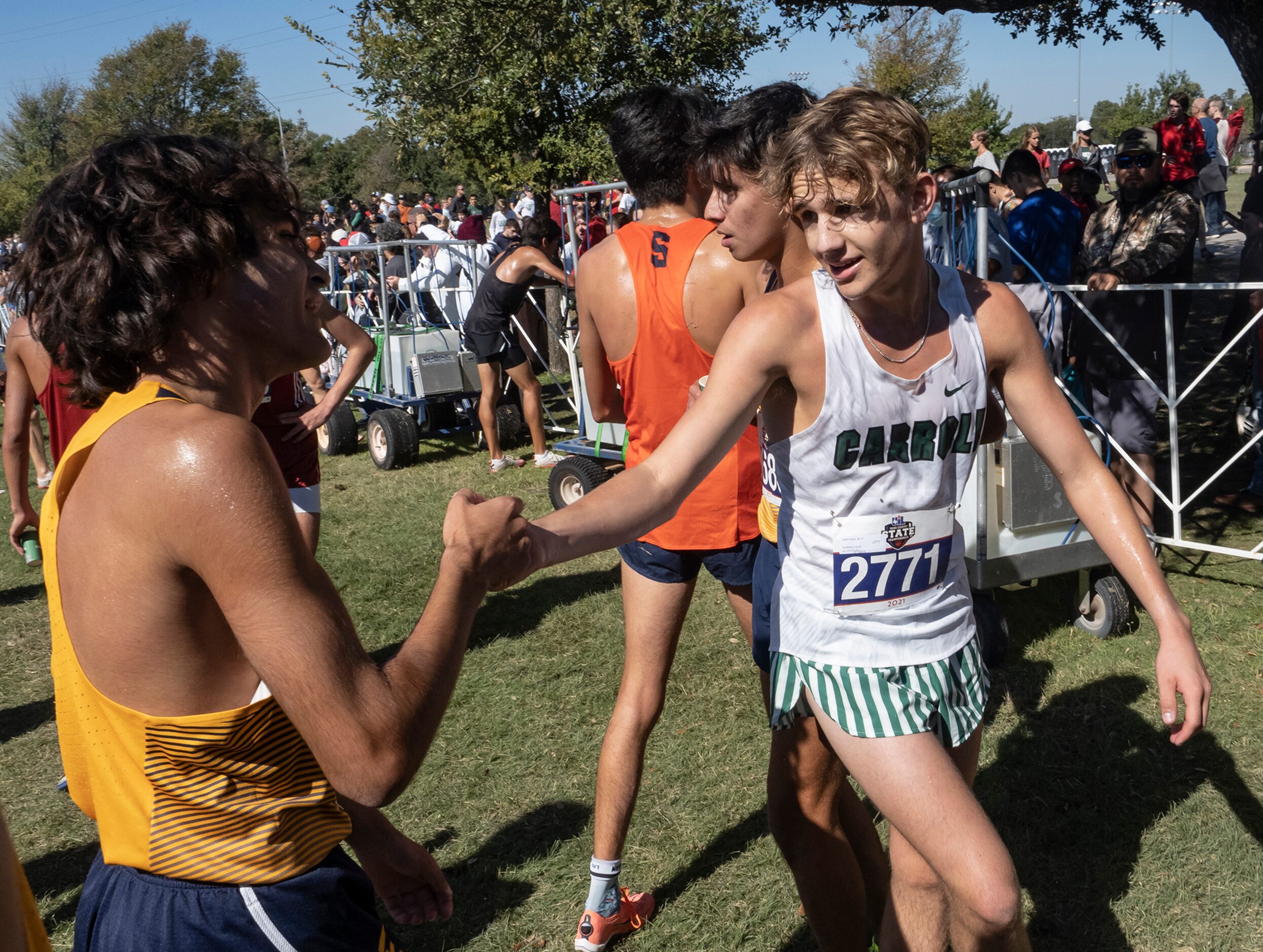 Southlake Carroll David Fisher (2771), right, congratulates El Paso Eastwood Jacob Beckett,...