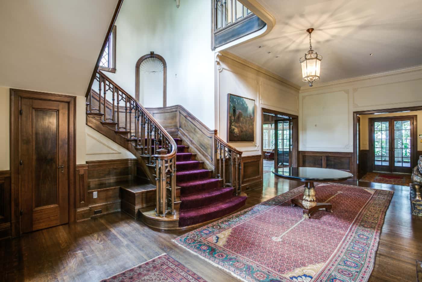 The main staircase at the Highland Park home of Sam Wyly at 3905 Beverly Drive. The house...