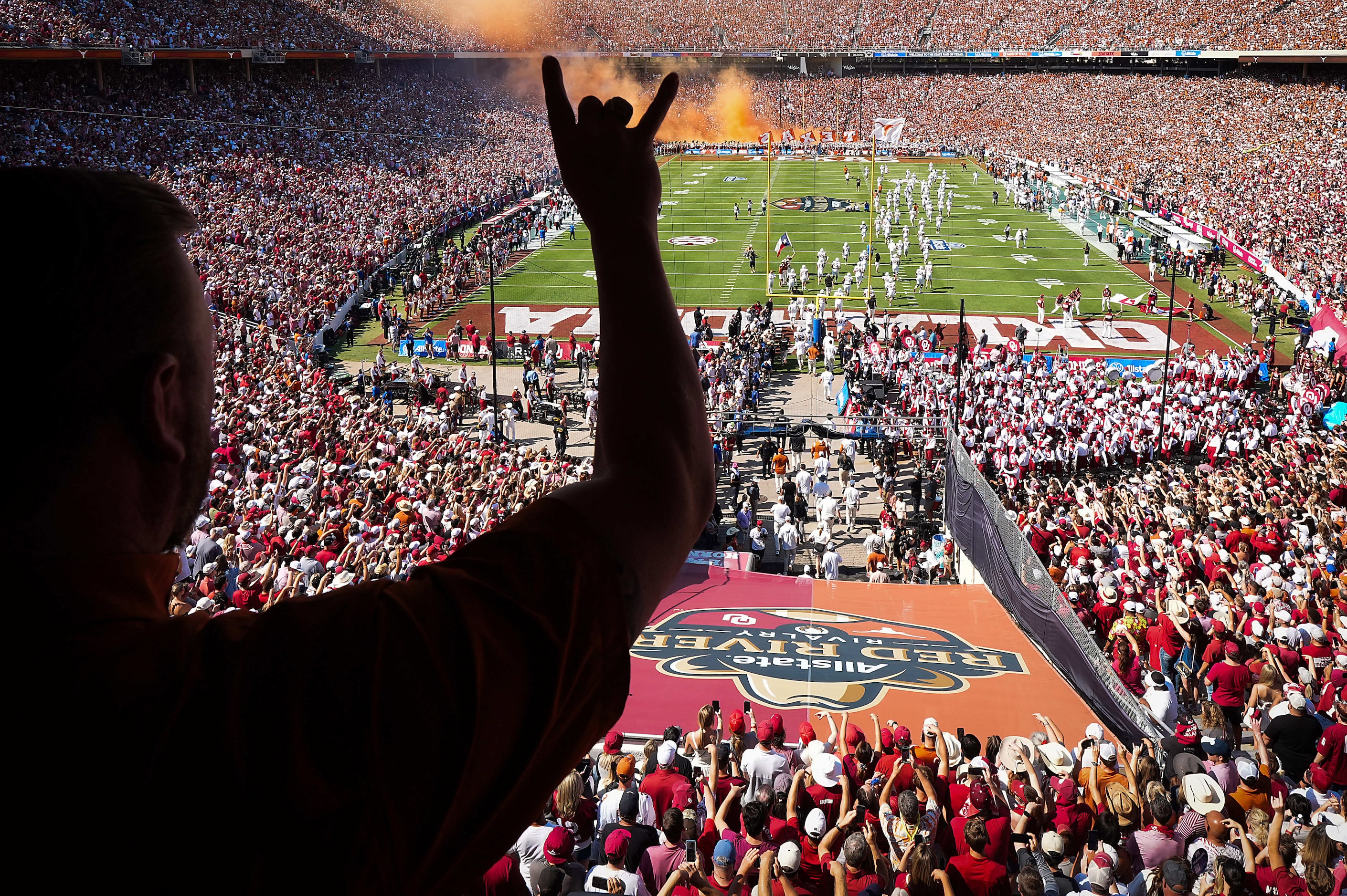 The Texas Longhorns fans cheer as their team takes the field before an NCAA college football...