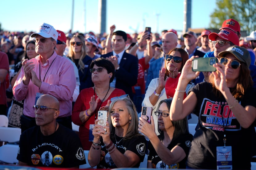 Supporters listen as Republican presidential nominee former President Donald Trump speaks at...