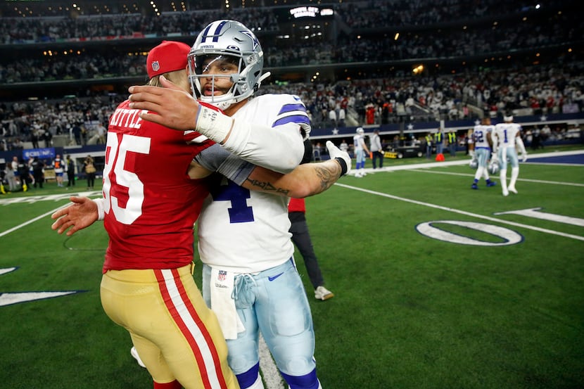 Dallas Cowboys quarterback Dak Prescott (4) congratulates San Francisco 49ers tight end...