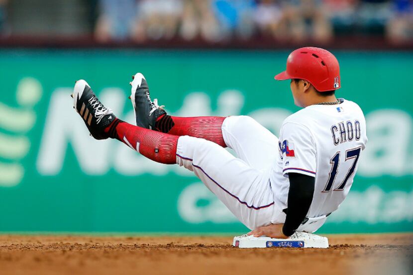 Texas Rangers designated hitter Shin-Soo Choo (17) ends up sitting on second base after...