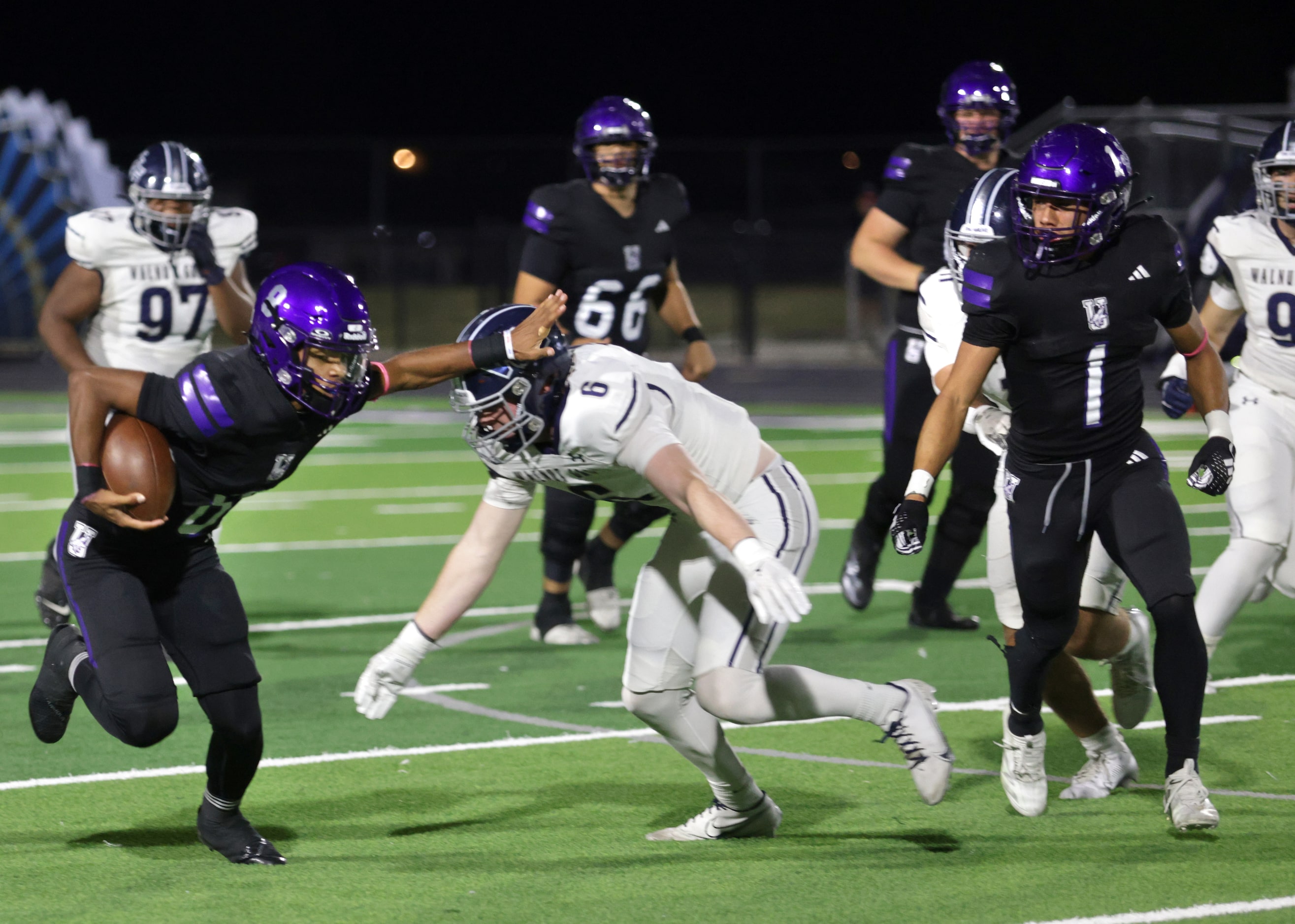 Anna player #8 Ziondre Williams breaks a tackle during the Prosper Walnut Grove High School...