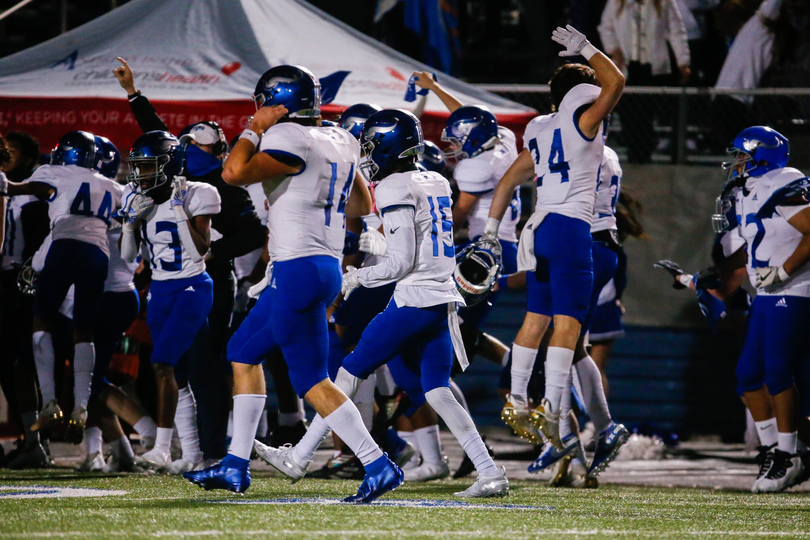 Fort Worth Nolan players celebrate an onside kick against Parish Episcopal during the fourth...