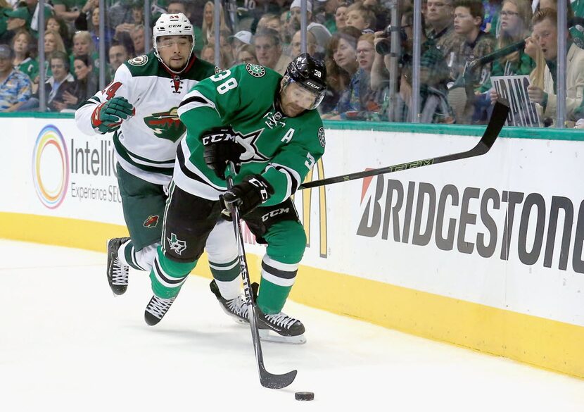 DALLAS, TX - APRIL 16:  Vernon Fiddler #38 of the Dallas Stars battles for control of the...