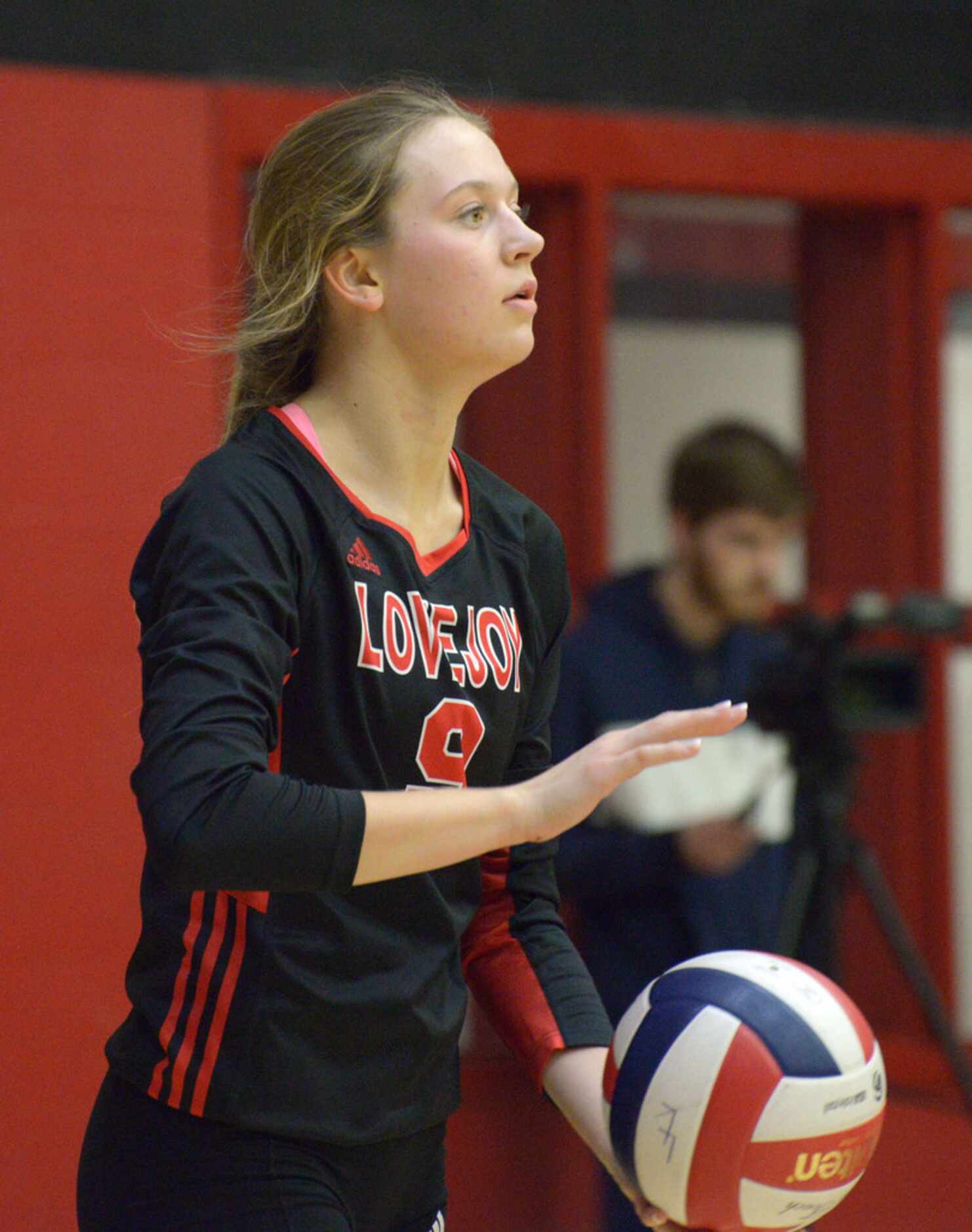 Lovejoy's Averi Carlson prepares to serve during a high school volleyball match between...