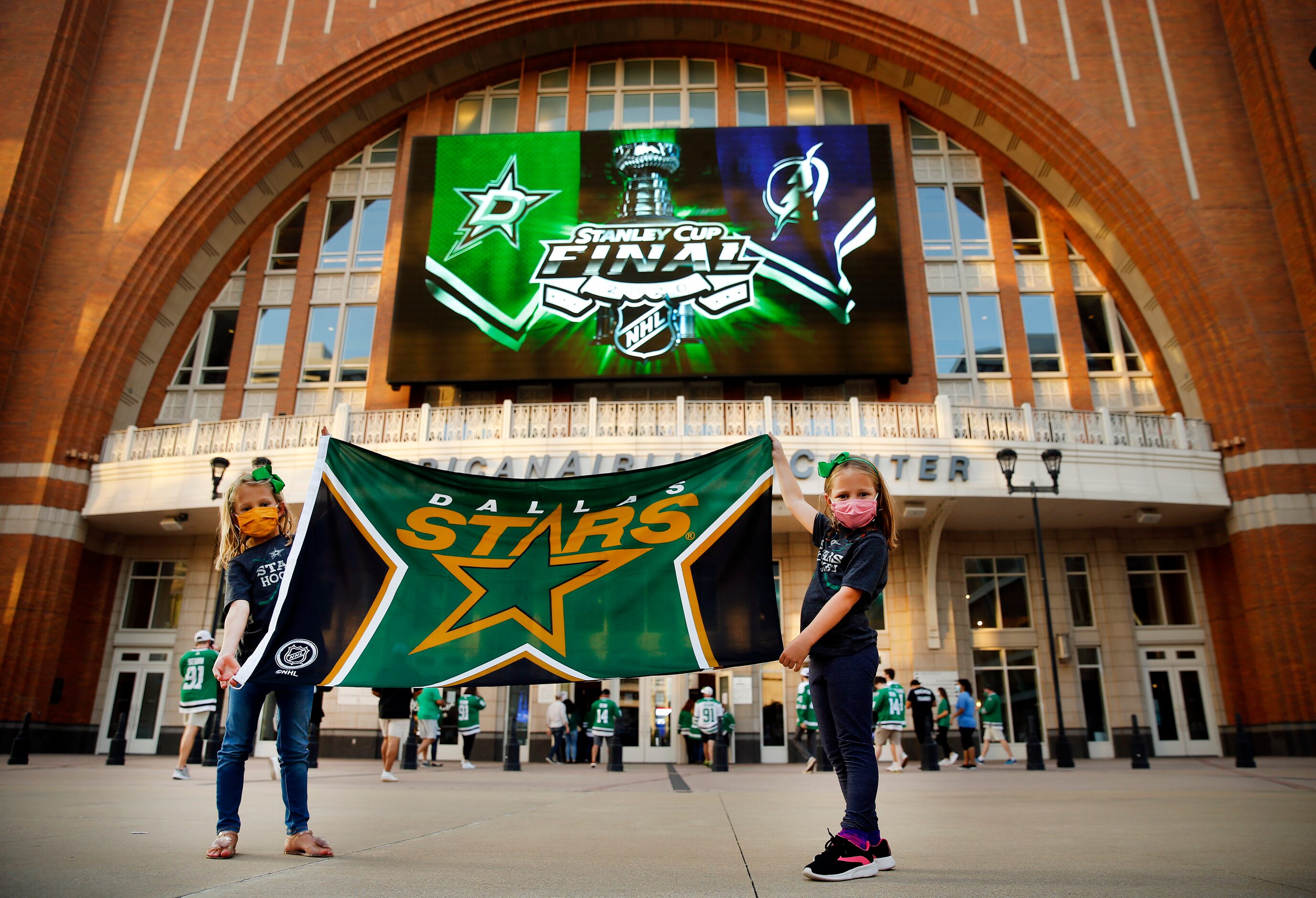 Dallas Stars fans Marlowe Beckner (left) and her sister Elin of Dallas display their team...