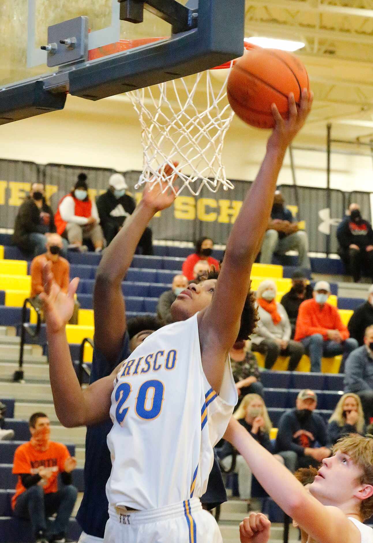 Frisco High School forward Micah Robinson (20) puts the ball up for a basket during the...