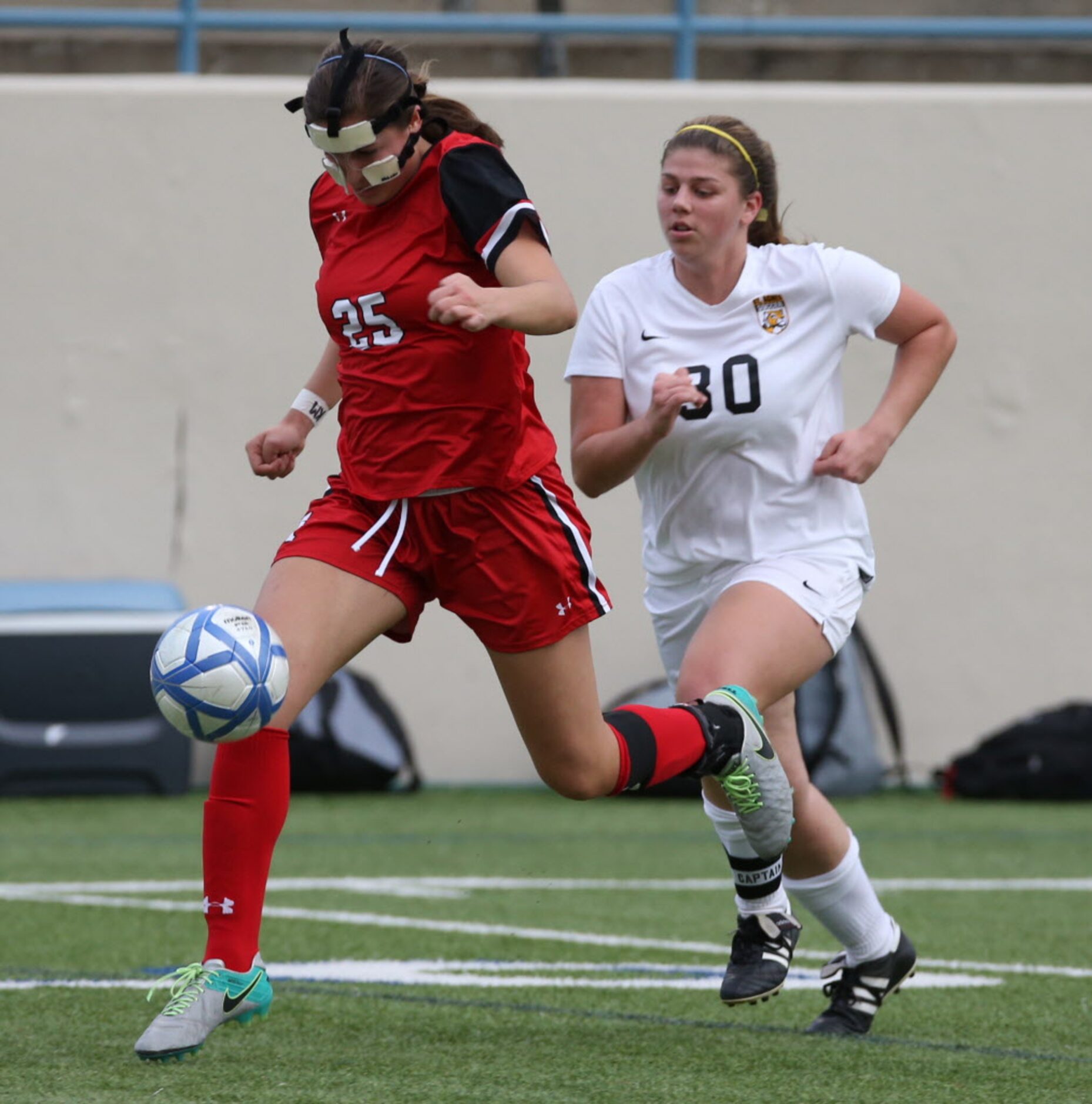 Ursuline Academys Alex Arenas (25) moves the ball past St. Agnes Academys Jordan Howard...