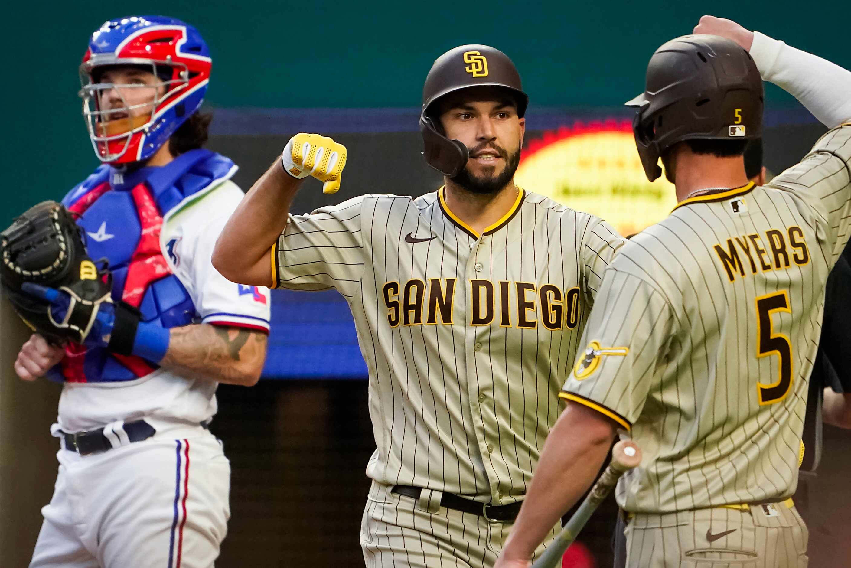 San Diego Padres first baseman Eric Hosmer celebrates with designated hitter Wil Myers after...