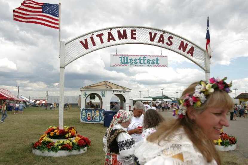 An arch with welcoming words greets visitors to Westfest. Westfest is an annual...